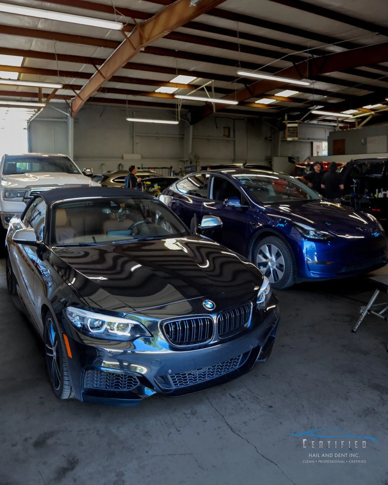 Interior hail repair bays at Certified Hail and Dent Colorado Springs