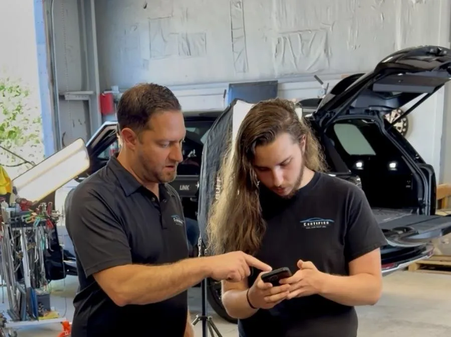 Technicians at Certified Hail and Dent reviewing a hail estimate in Colorado Springs