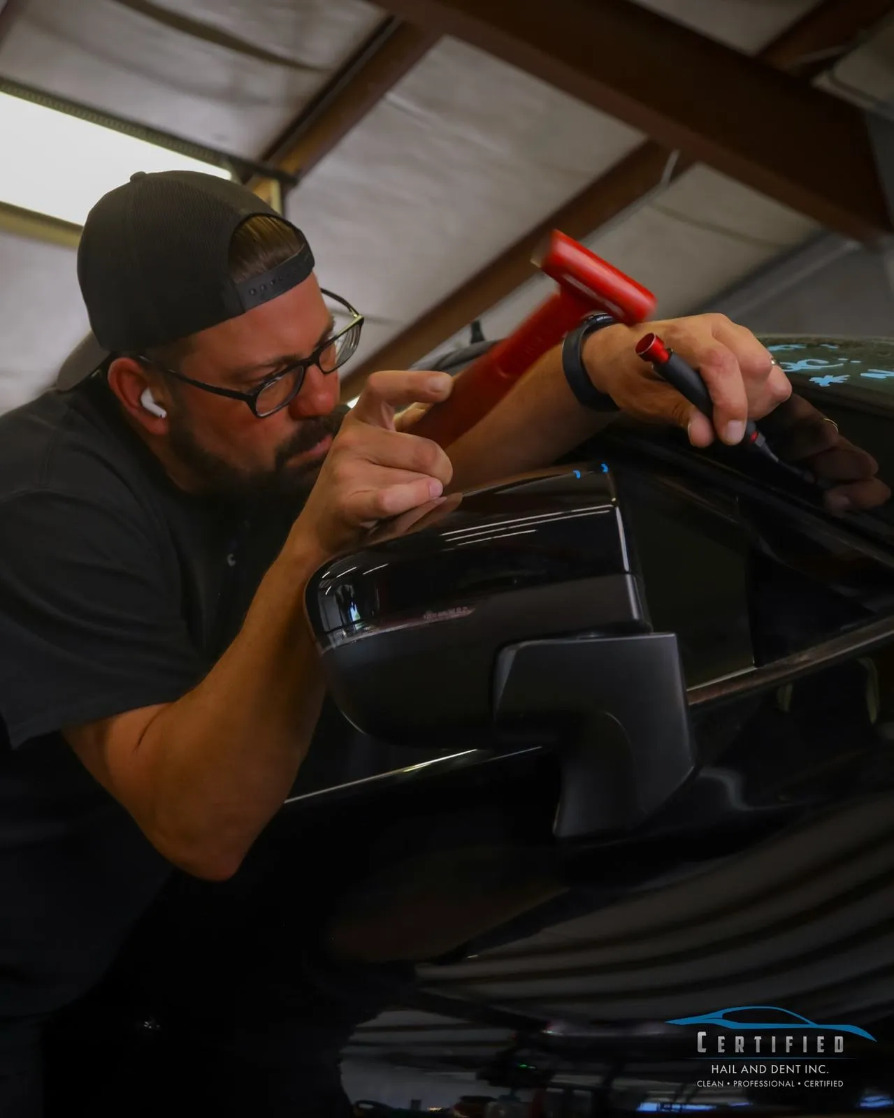 Technician working hail dents at Certified Hail and Dent Colorado Springs